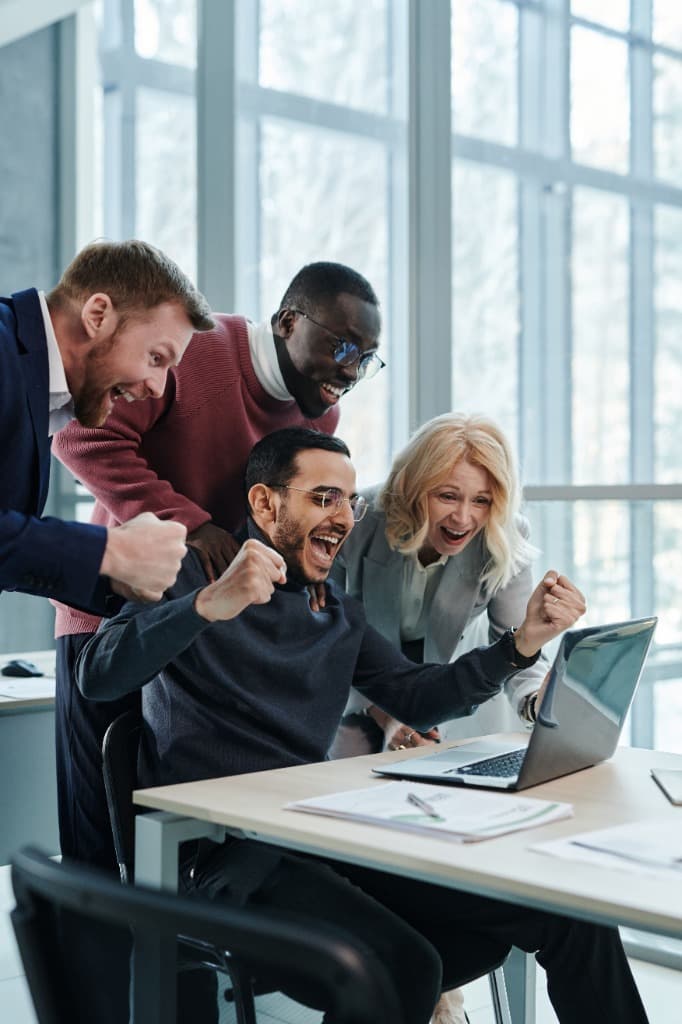 The Growth Protocol - Team collaborating on a laptop